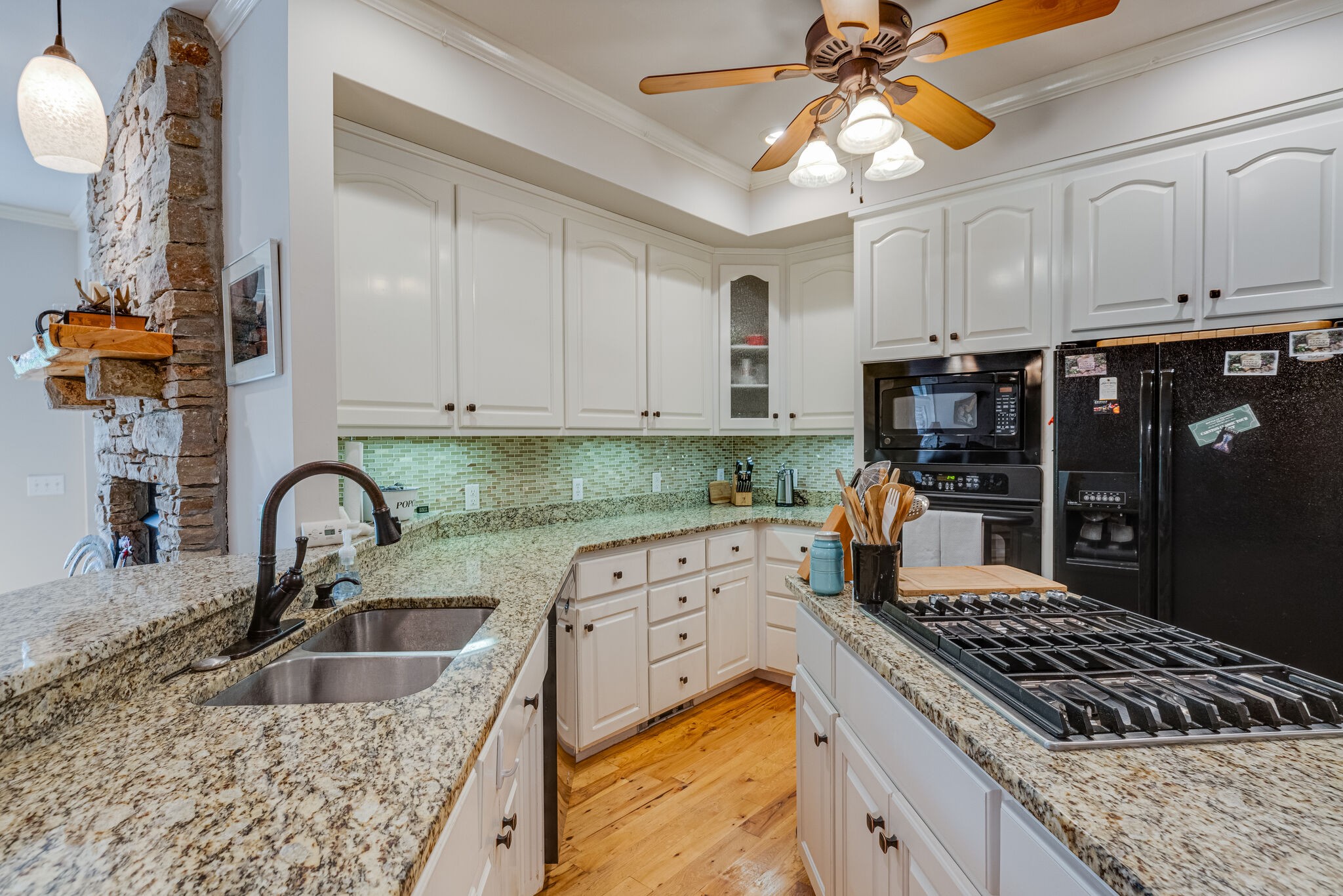 7107 Wells Cemetery Road Dickson, TN 37055 - Photo 7 of 59 a kitchen with white cabinets a sink dishwasher and stove