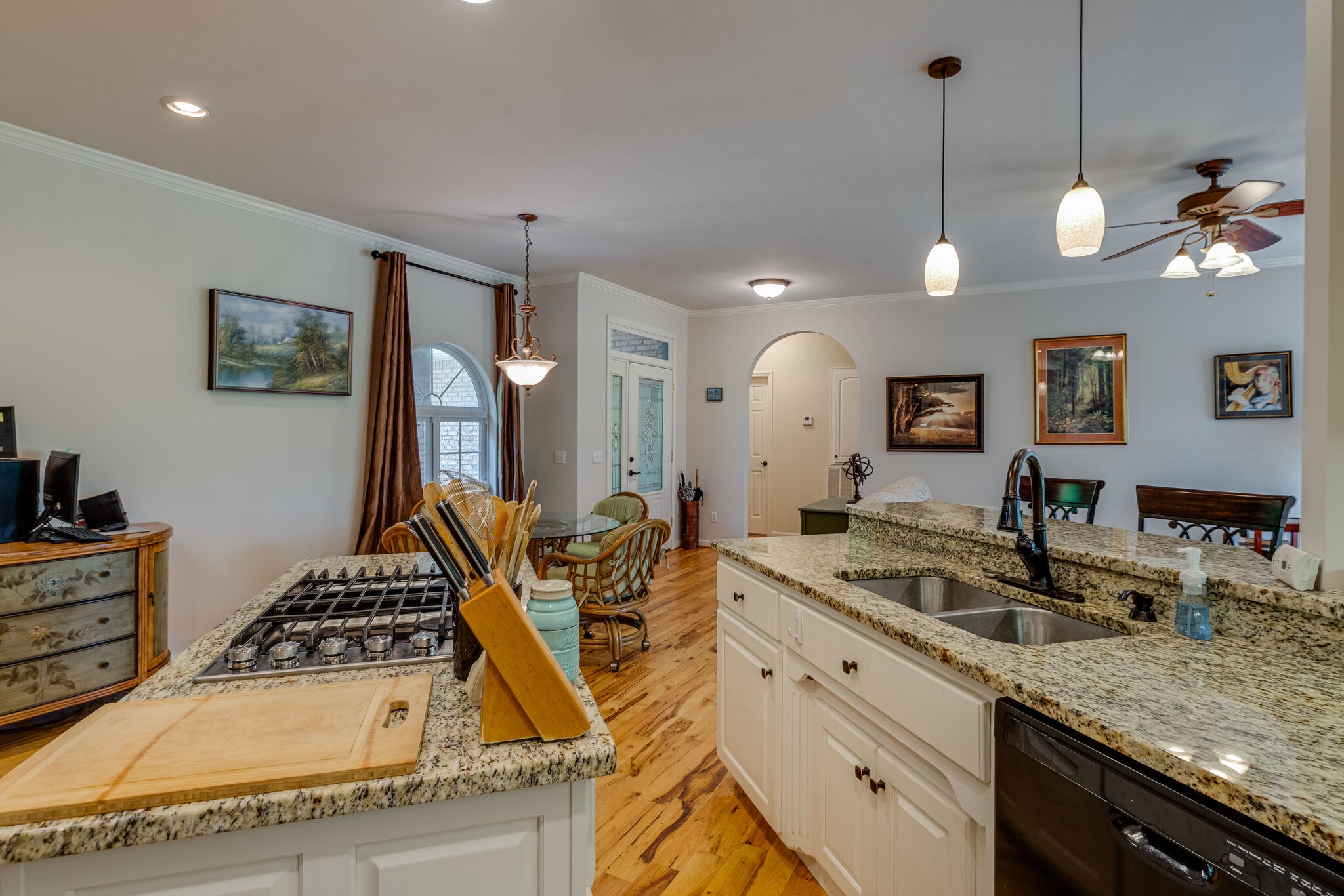 7107 Wells Cemetery Road Dickson, TN 37055 - Photo 10 of 59 a kitchen with stainless steel appliances granite countertop a stove a sink and a refrigerator