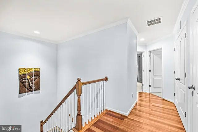a bedroom with a bed and a large window with the outer view