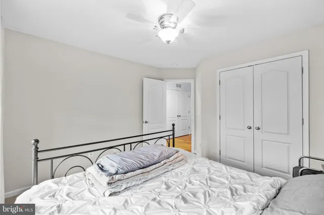 a bedroom with a bed next to a window with outer view