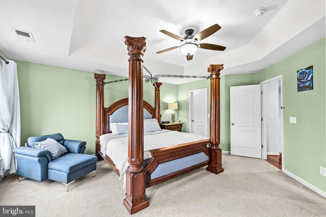 a bathroom with a granite countertop sink mirror and shower
