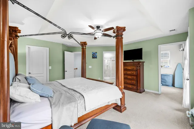 a bath tub sitting in a bathroom next to a window