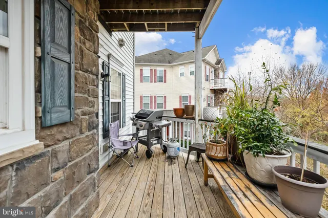 a view of balcony with furniture and wooden floor