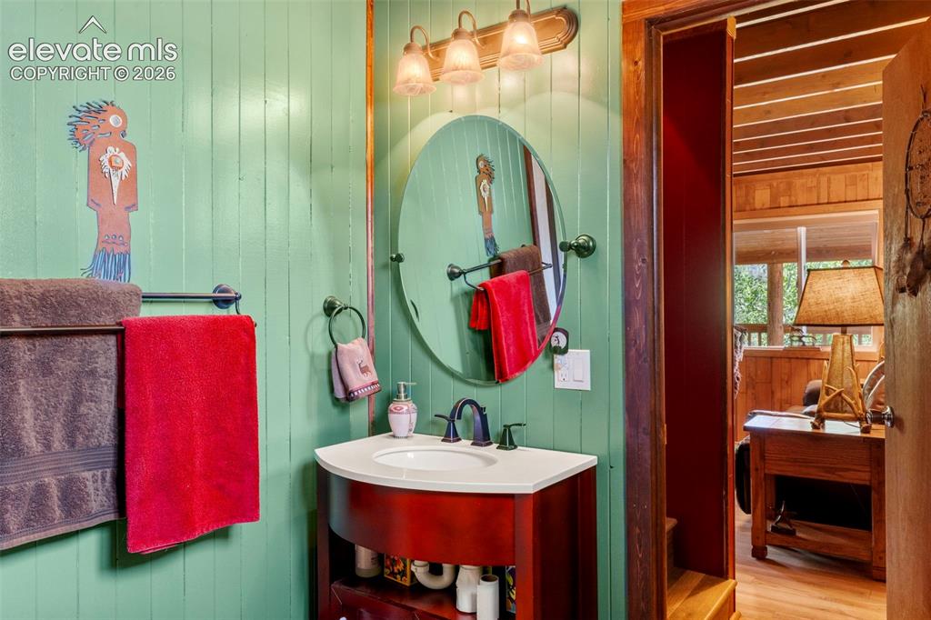 546 Pulver Road Lake George, CO 80827 - Photo 18 of 45 a bathroom with a sink vanity and mirror