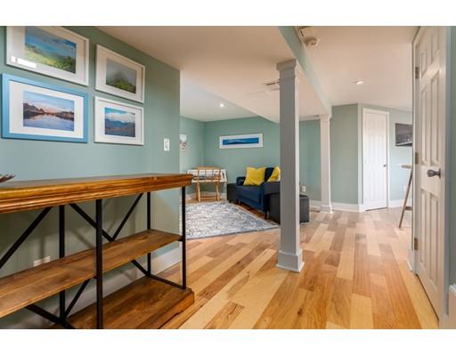 73 Woobly Road Bolton, MA 01740 - Photo 23 of 30 a view of living room kitchen with furniture and wooden floor