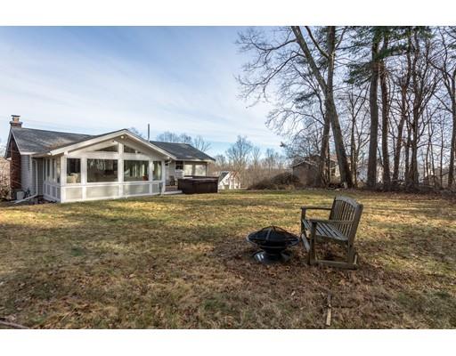 73 Woobly Road Bolton, MA 01740 - Photo 27 of 30 a backyard of a house with table and chairs