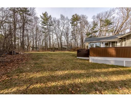 73 Woobly Road Bolton, MA 01740 - Photo 28 of 30 a backyard of a house with lots of green space