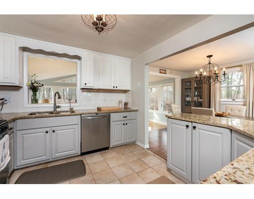 73 Woobly Road Bolton, MA 01740 - Photo 8 of 30 a kitchen with a sink stove and cabinets