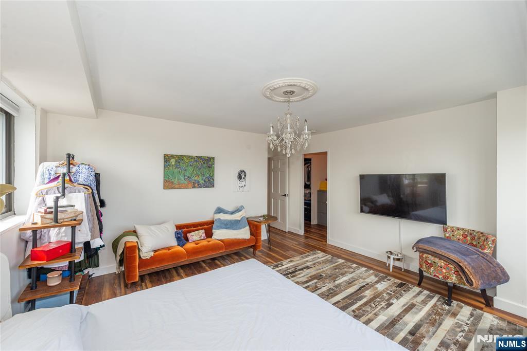 90 Prospect Avenue, Unit 10A Hackensack, NJ 07601 - Photo 17 of 35 a living room with furniture and a flat screen tv