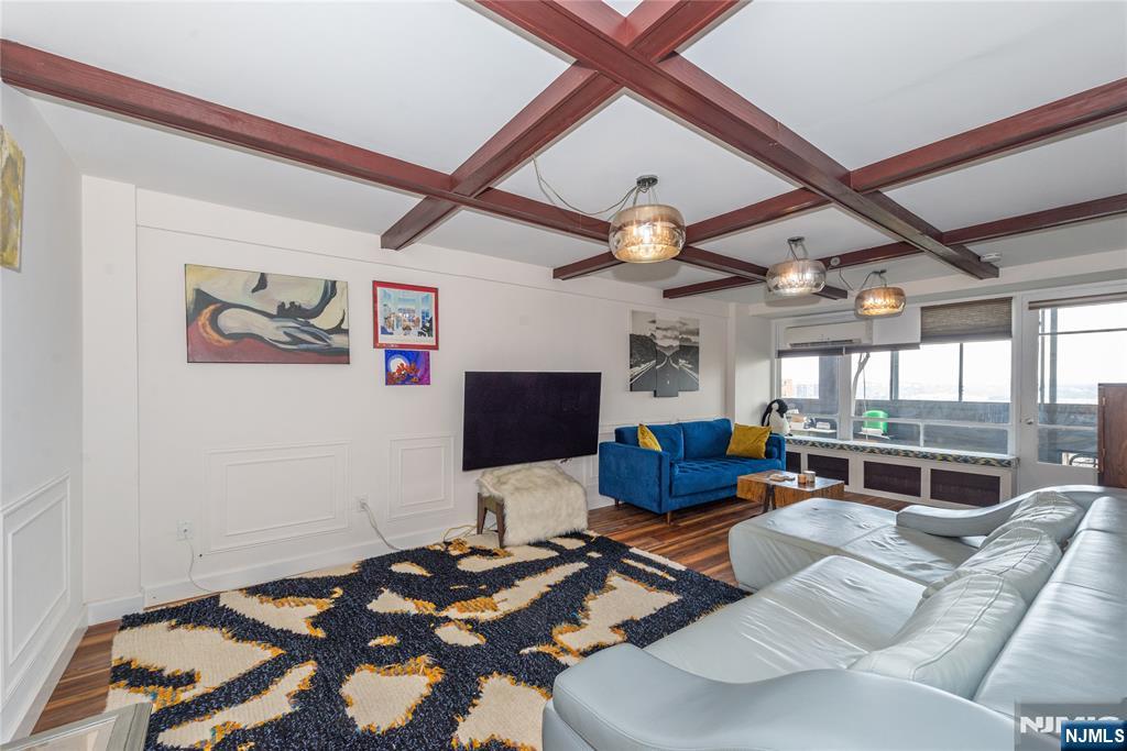 90 Prospect Avenue, Unit 10A Hackensack, NJ 07601 - Photo 5 of 35 a living room with furniture and a large window