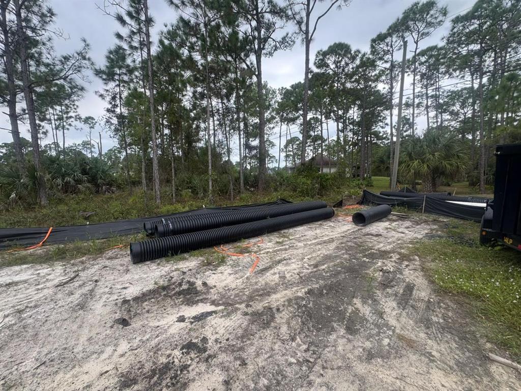607 Reading Street Southeast Palm Bay, FL 32909 - Photo 3 of 10 a backyard of a house with lots of green space