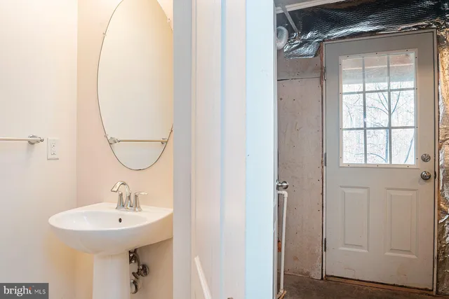 a view of a house with brick walls