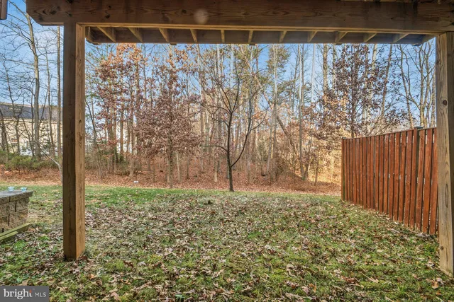 a view of a house with garden and trees