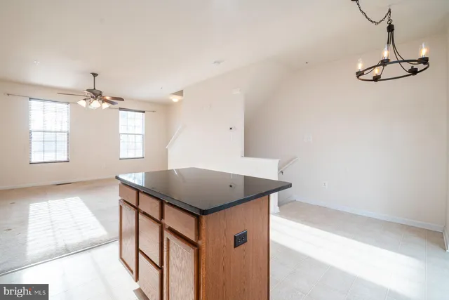 a kitchen that has a lot of countertop in it