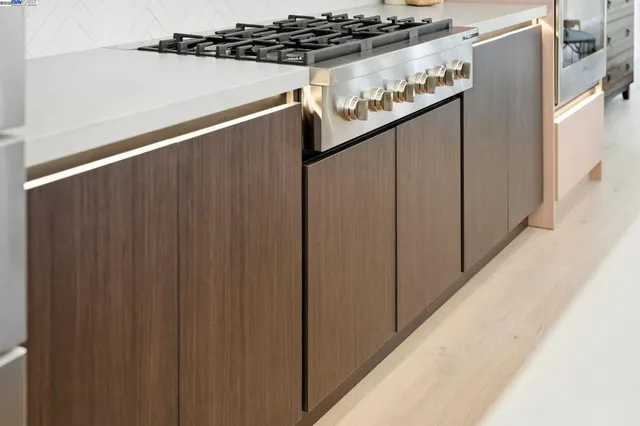 a view of a dining room with furniture and a potted plant