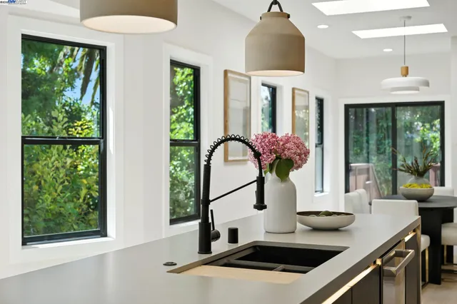 a room with a ceiling fan and a window