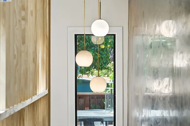 a bedroom with bed and a potted plant