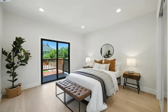 a view of an empty room with closet and a window