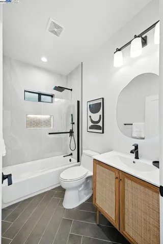 a view of kitchen with stainless steel appliances kitchen island a sink dishwasher a refrigerator and a fireplace