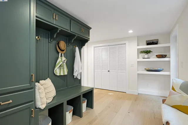 a living room with furniture and a gym