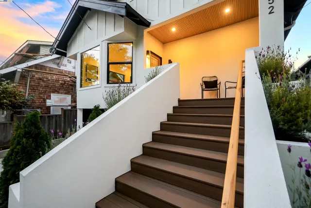 a view of a hallway with wooden floor and dining room