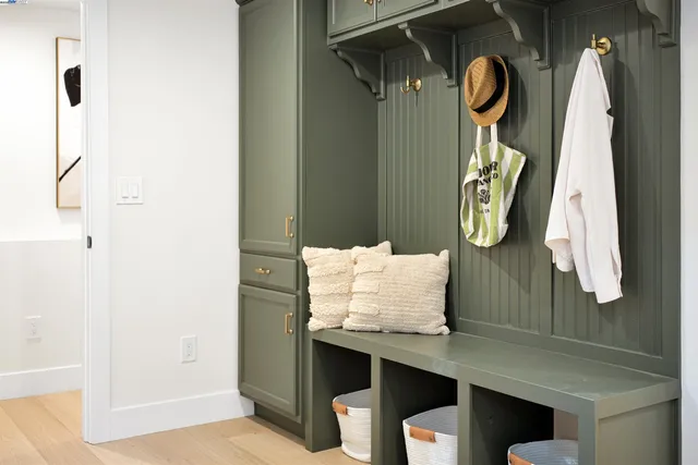 a bedroom with a bed and cabinet