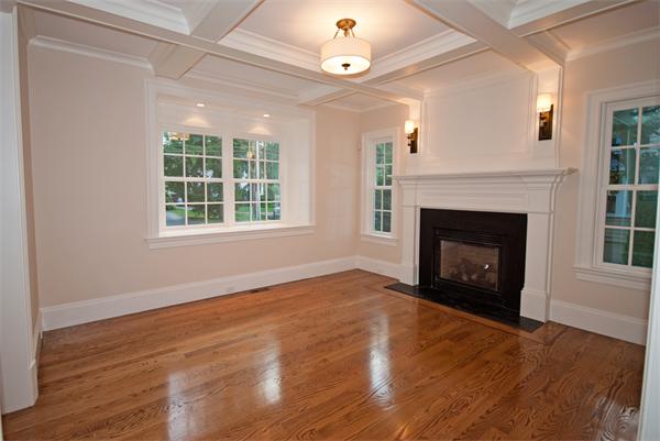 24 Elmwood Road Wellesley, MA 02481 - Photo 4 of 11 a view of an empty room with wooden floor fireplace and a window