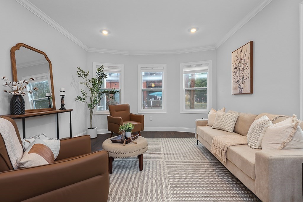 200-202 Elliot Street, Unit 1 Newton, MA 02464 - Photo 13 of 35 a living room with furniture and wooden floor