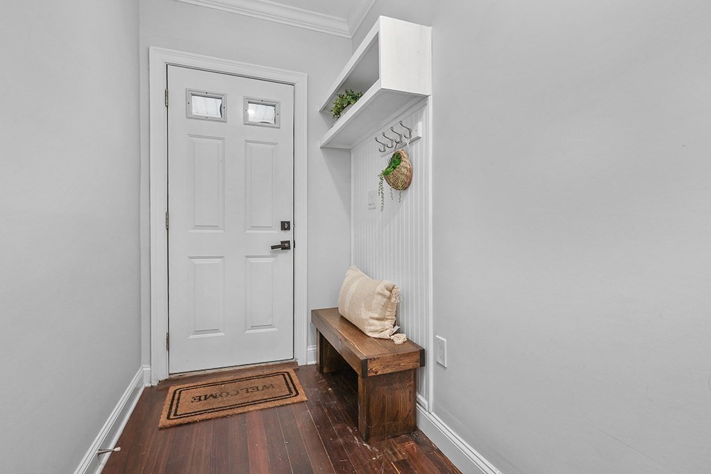 200-202 Elliot Street, Unit 1 Newton, MA 02464 - Photo 20 of 35 a view of an entryway with wooden floor