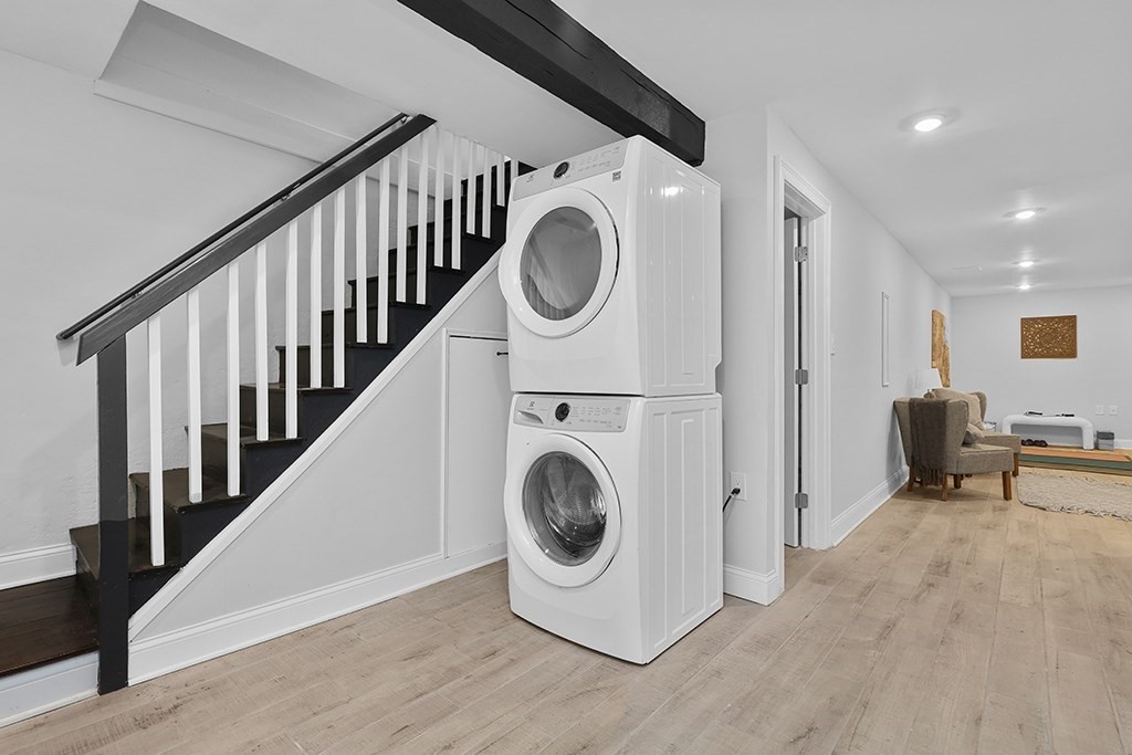 200-202 Elliot Street, Unit 1 Newton, MA 02464 - Photo 21 of 35 a view of a hallway with washer and dryer