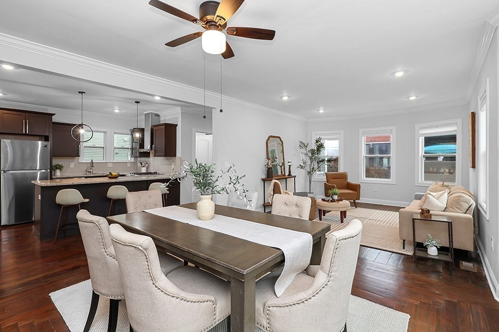 200-202 Elliot Street, Unit 1 Newton, MA 02464 - Photo 5 of 35 a view of a dining room with furniture window and wooden floor