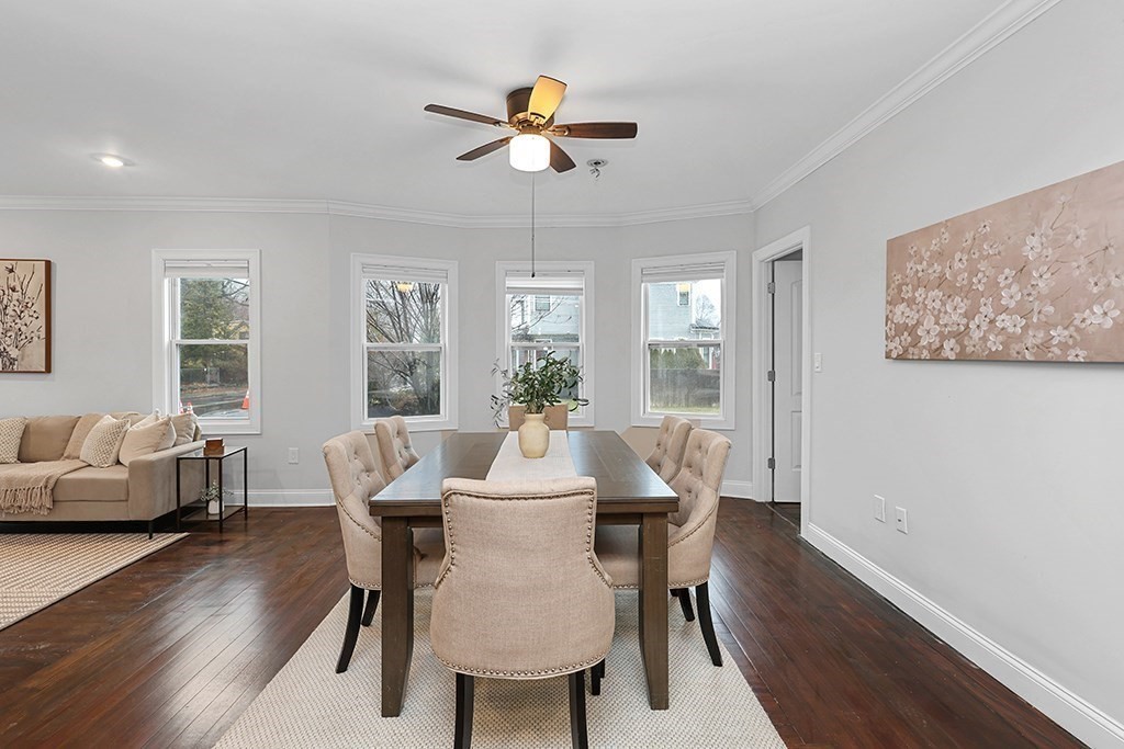 200-202 Elliot Street, Unit 1 Newton, MA 02464 - Photo 6 of 35 a view of a dining room with furniture window and wooden floor