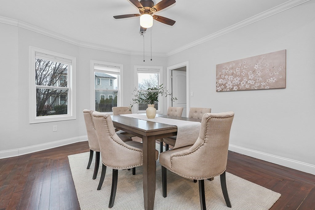 200-202 Elliot Street, Unit 1 Newton, MA 02464 - Photo 7 of 35 a view of a dining room with furniture window and wooden floor