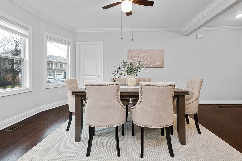200-202 Elliot Street, Unit 1 Newton, MA 02464 - Photo 8 of 35 a view of a dining room with furniture window and wooden floor