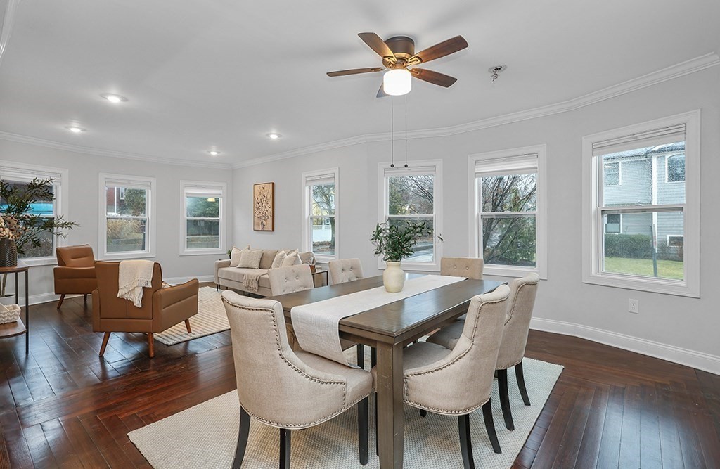 200-202 Elliot Street, Unit 1 Newton, MA 02464 - Photo 9 of 35 a view of a dining room with furniture window and wooden floor