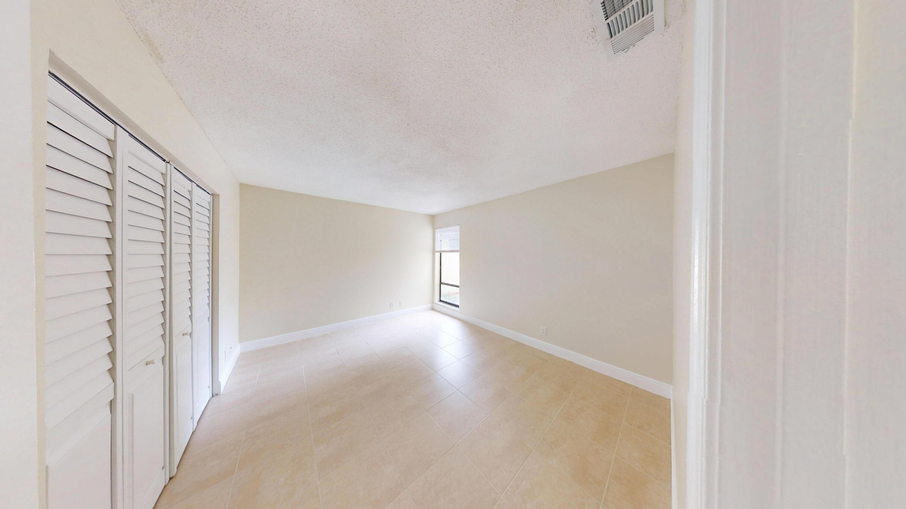 3143 Kingswood Terrace Boca Raton, FL 33431 - Photo 13 of 21 a view of an empty room with a window