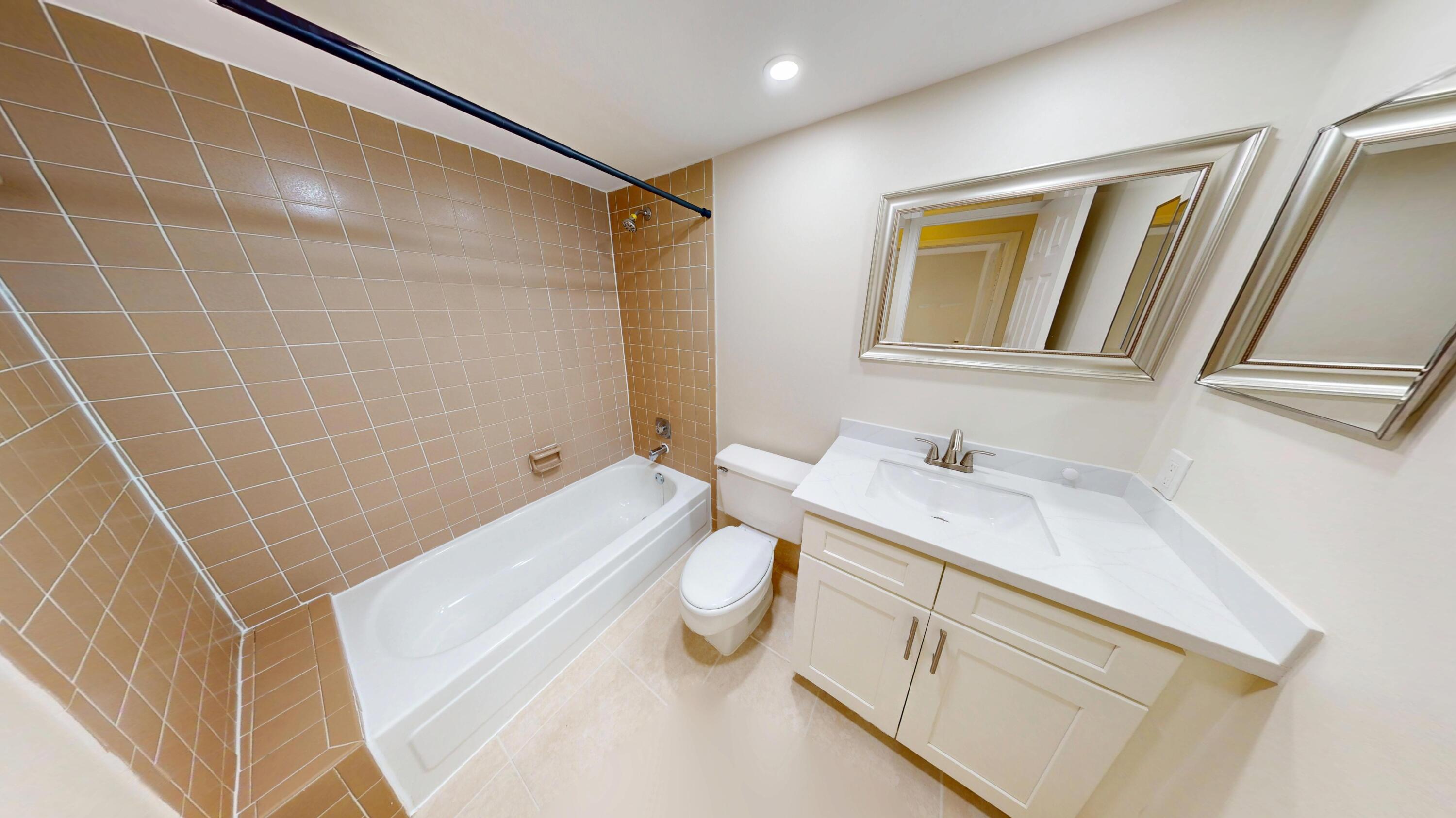 3143 Kingswood Terrace Boca Raton, FL 33431 - Photo 14 of 21 a bathroom with a sink a toilet and shower