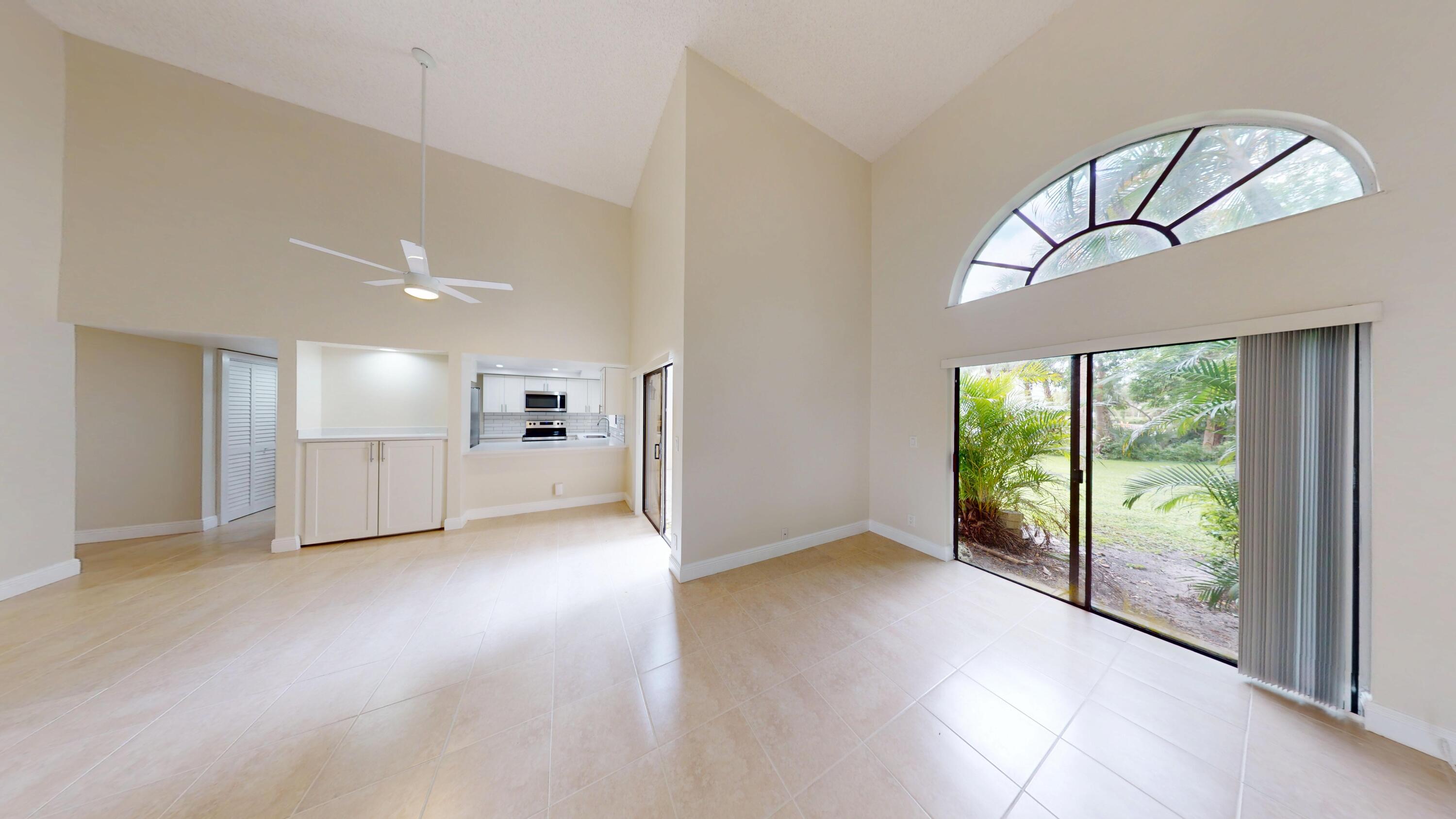 3143 Kingswood Terrace Boca Raton, FL 33431 - Photo 3 of 21 a view of empty room with floor to ceiling window