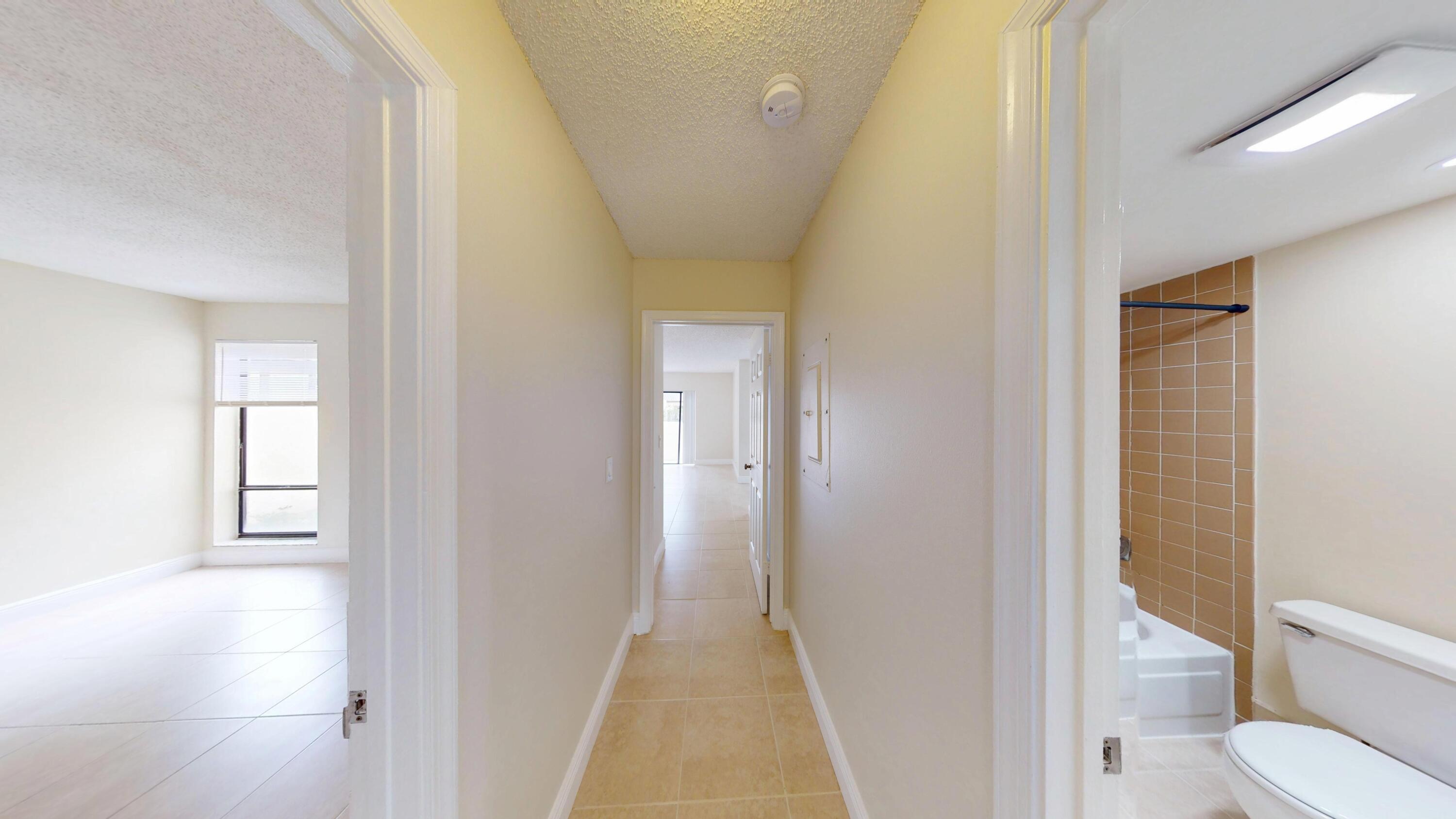 3143 Kingswood Terrace Boca Raton, FL 33431 - Photo 5 of 21 a bathroom with a toilet and a shower