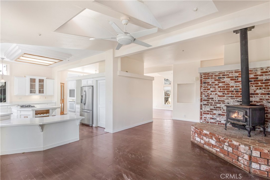 2311 Rose Road Fallbrook, CA 92028 - Photo 12 of 50 a living room with stainless steel appliances furniture a rug and a view of kitchen