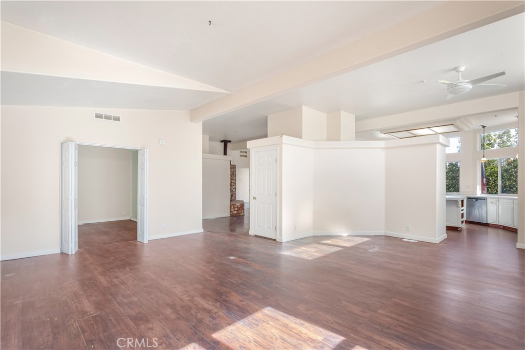 2311 Rose Road Fallbrook, CA 92028 - Photo 15 of 50 a view of a big room with wooden floor and windows