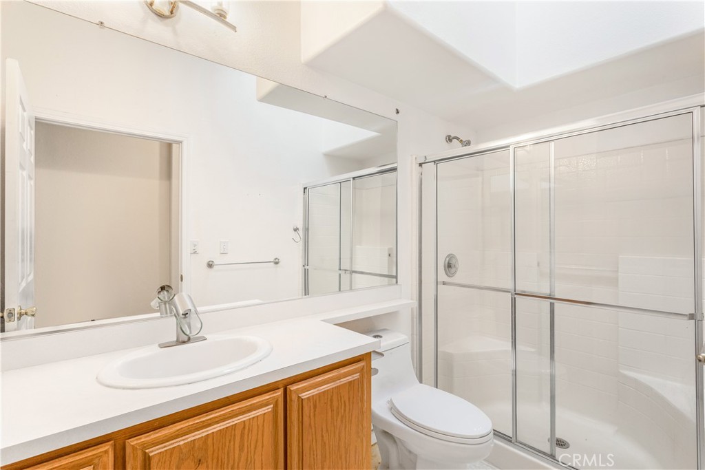 2311 Rose Road Fallbrook, CA 92028 - Photo 22 of 50 a bathroom with a granite countertop sink toilet and shower