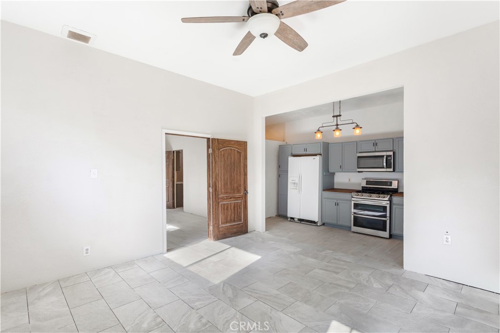 2311 Rose Road Fallbrook, CA 92028 - Photo 29 of 50 a view of a kitchen with refrigerator and cabinet