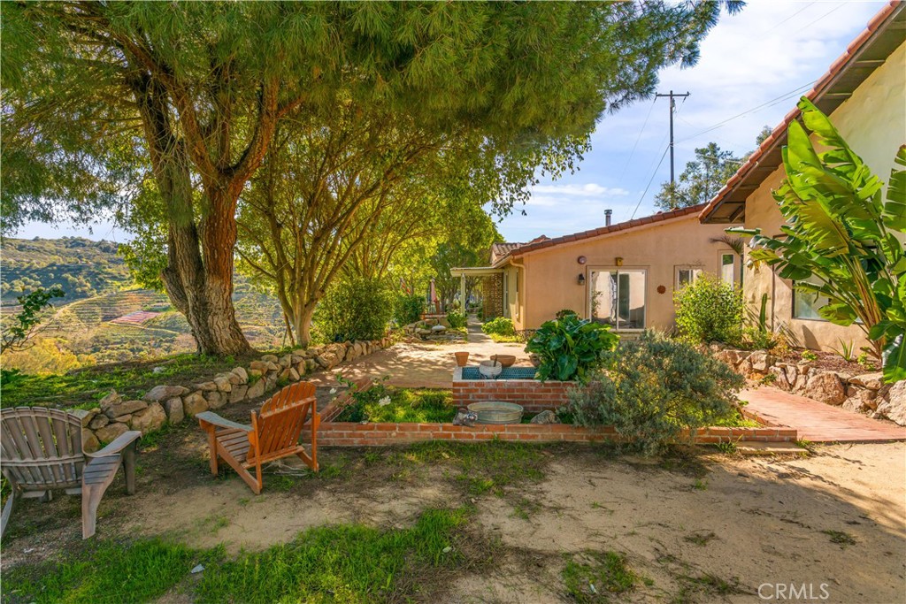 2311 Rose Road Fallbrook, CA 92028 - Photo 3 of 50 a backyard of a house with table and chairs