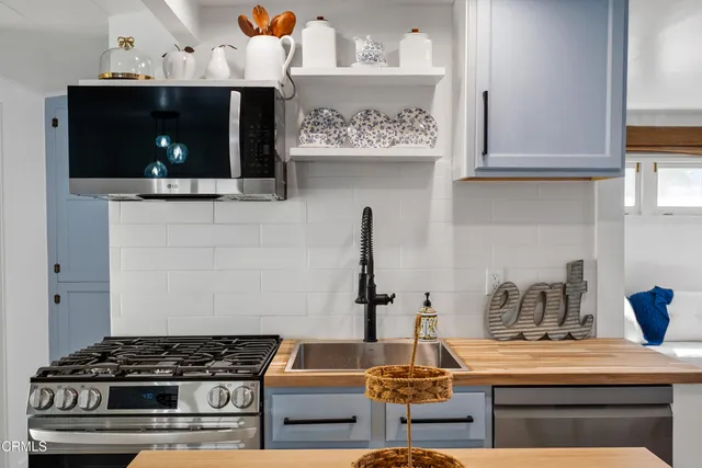 a kitchen with a stove and a microwave