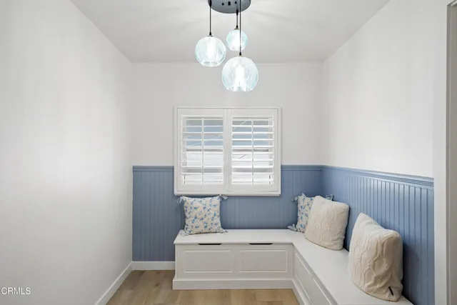 a living room with furniture a table and a window