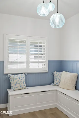 a bathroom with a bathtub and next to a window
