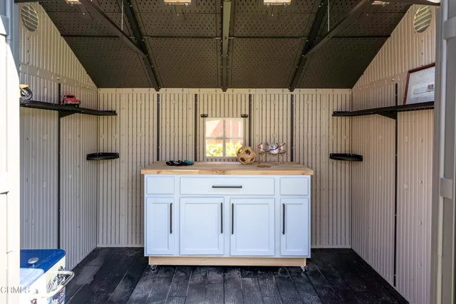 a kitchen with a sink and a refrigerator