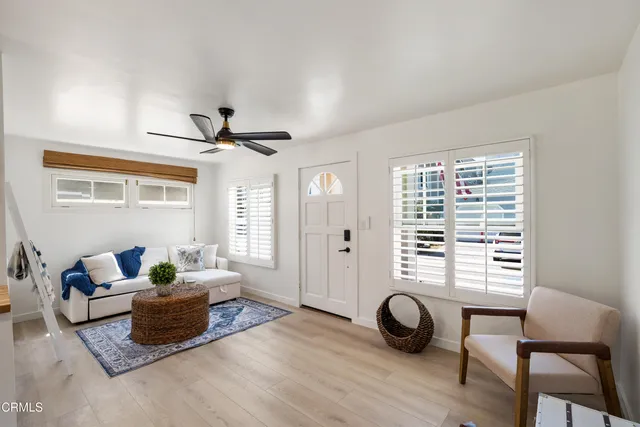a living room with furniture and a window