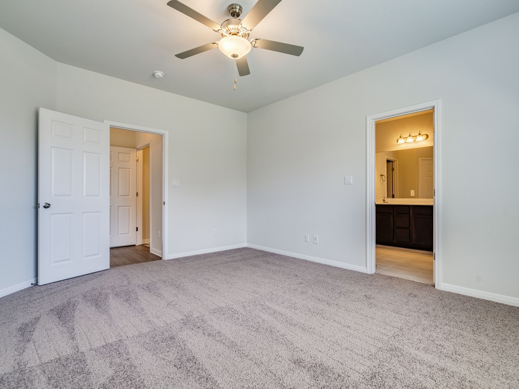 4113 Birdwatch Loop, Unit 21 Pflugerville, TX 78660 - Photo 10 of 30 a view of an empty room with a bathroom
